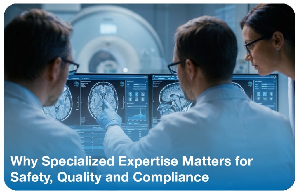 Medical physicists reviewing MRI brain scans on monitors in front of an MRI scanner
